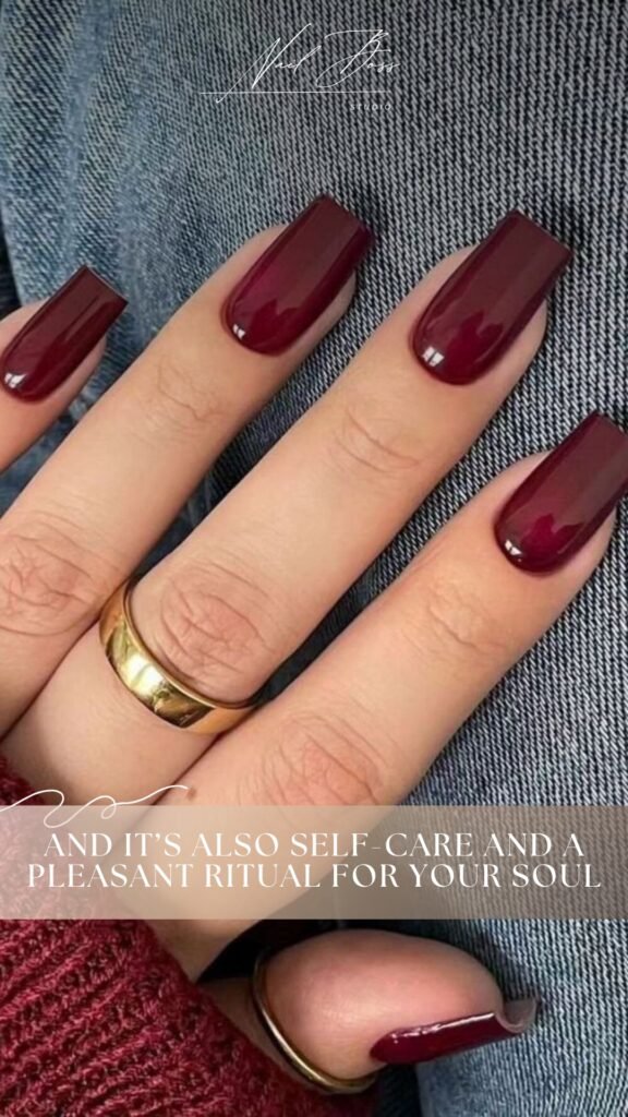 Deep red glossy nails created using builder gel manicure technique at Nail Boss Studio Tampa.