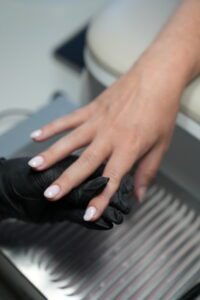 Close-up of builder gel manicure Tampa at Nail Boss Studio showing elegant pink nails.