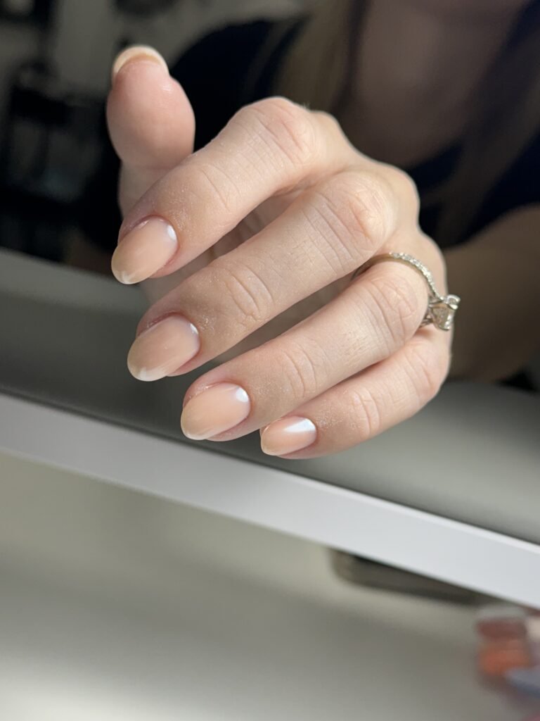 Natural nude nails with glossy finish after builder gel manicure Tampa at Nail Boss Studio.