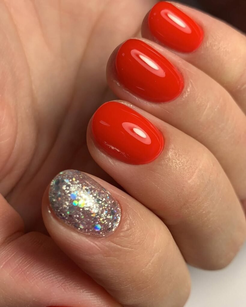 Red glossy manicure with glitter accent using european manicure near me in Tampa.