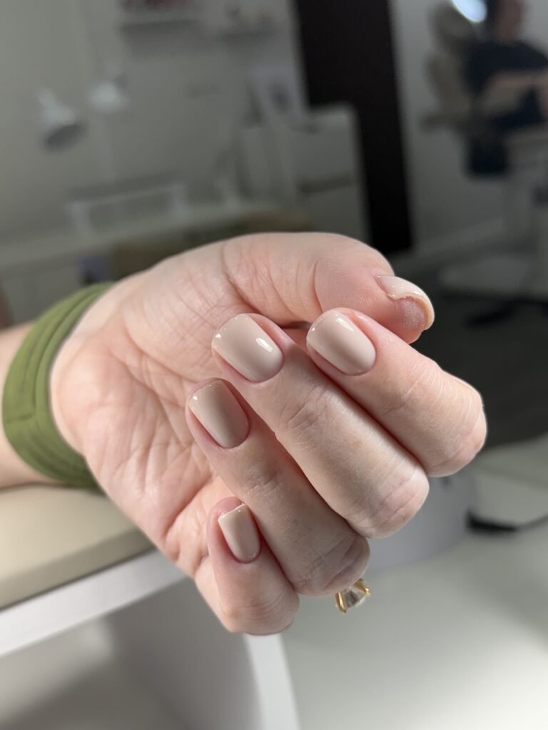 Natural nude hard gel russian manicure in Tampa with short elegant nails.