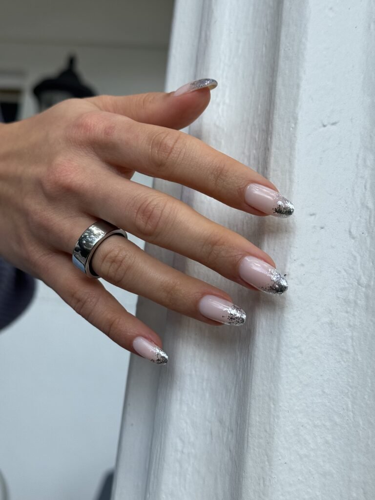Elegant silver-tipped hard gel nails with russian manicure in Tampa, Florida.