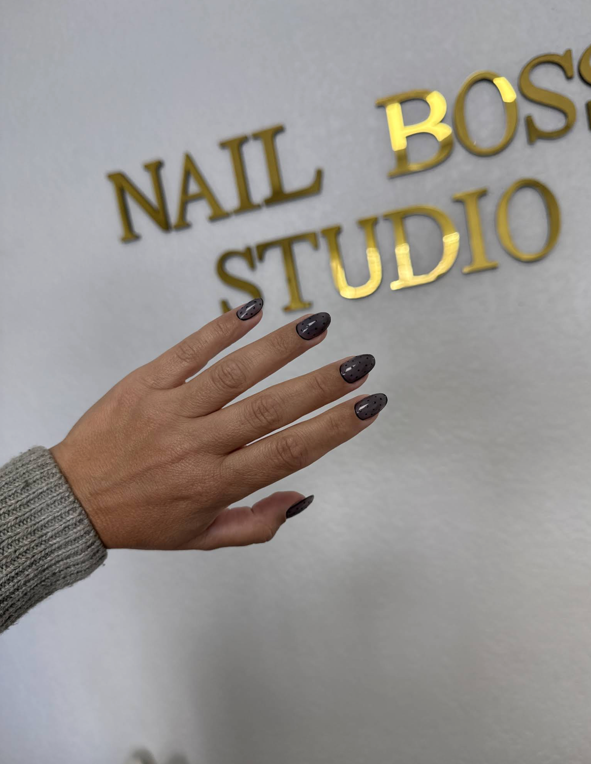 Russian manicure with dark gel polish at Nail Boss Studio Tampa