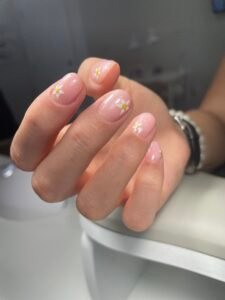 Close-up of a Russian manicure with soft pastel polish in Tampa, Florida.