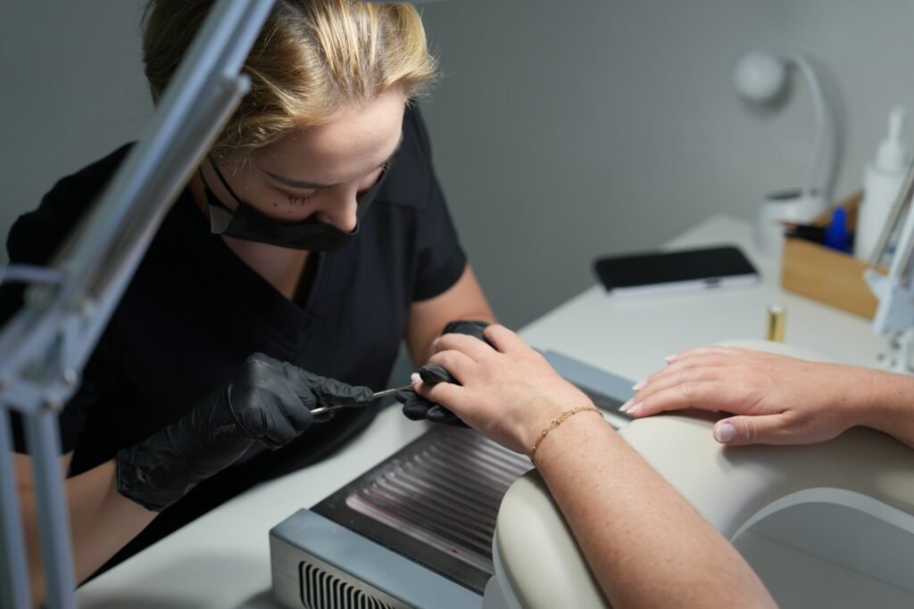 Nail artist performing russian manicures near me in Tampa with precision and care.