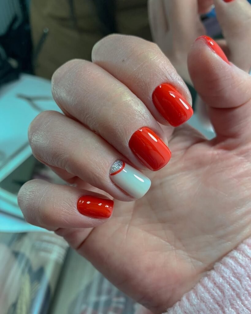 Bright red nails with silver accent created by russian manicures Tampa technique.