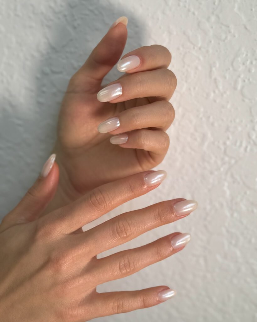 Soft pearl hard gel russian nails in Tampa, elegant almond shape.