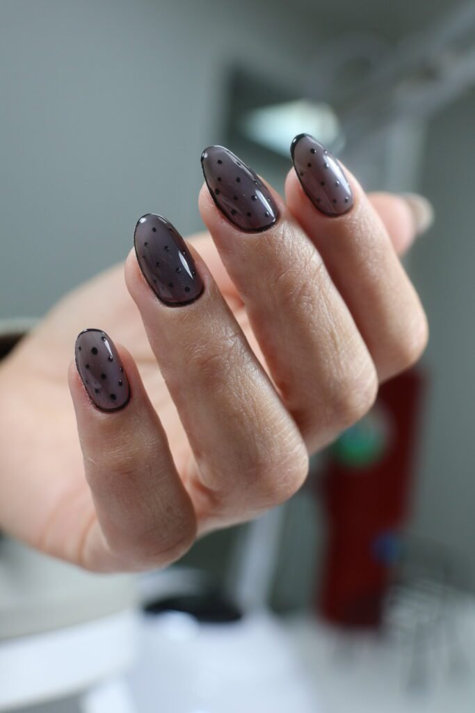 Elegant smoky gray nails with black dot design, created using russian nails Tampa technique at Nail Boss Studio.