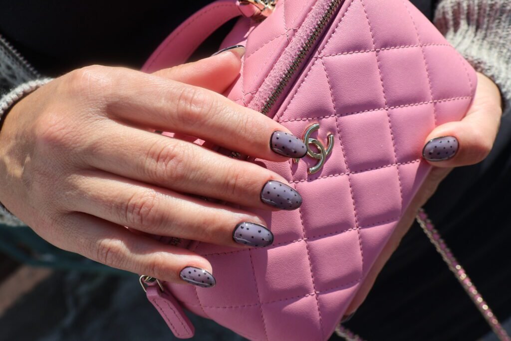 Gray nails with polka-dot design created using russian nails technique at Nail Boss Studio Tampa.