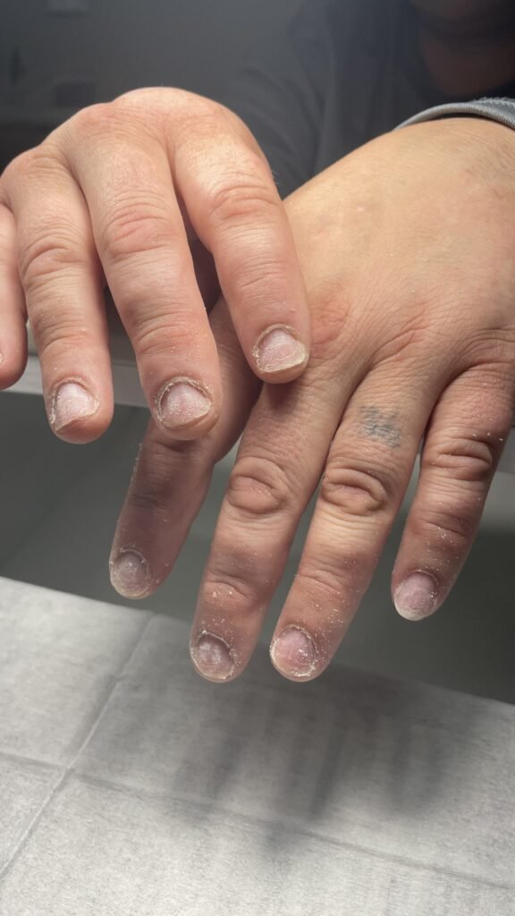 Men’s hands after russian manicure for man near me in Tampa.