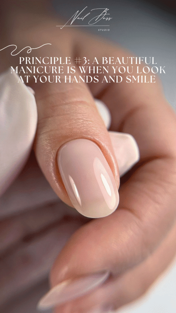 Close-up of soft pink glossy nails after russian manicure in Tampa, Florida.