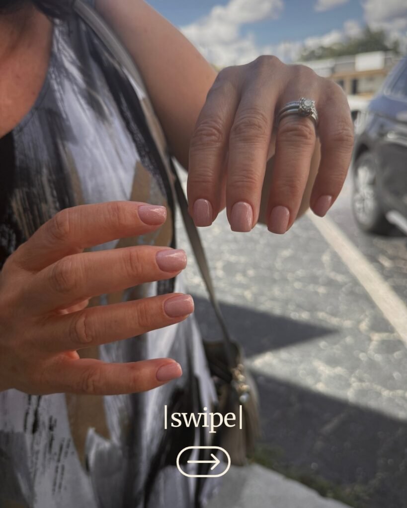 Hands with natural nude manicure outdoors in Tampa, showing russian manicure near me results.