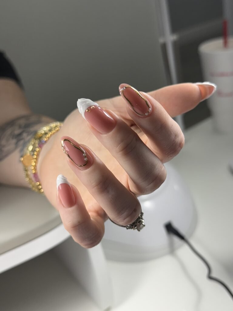 Elegant long nails with white sculpted tips after a russian manicure near me in Tampa, Florida.