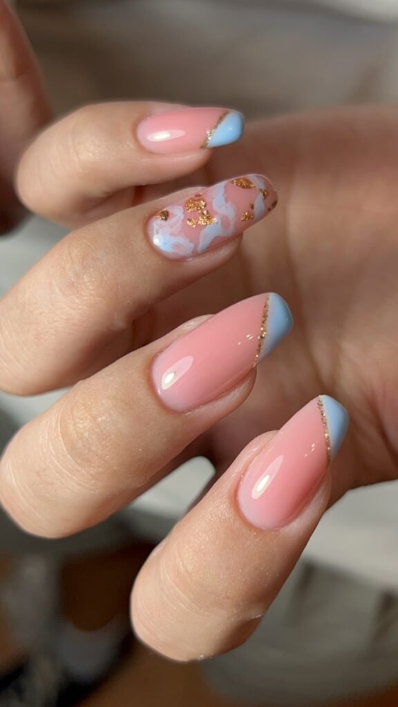 Close-up of pink and blue glossy nails after a russian manicure near me in Tampa, Florida.