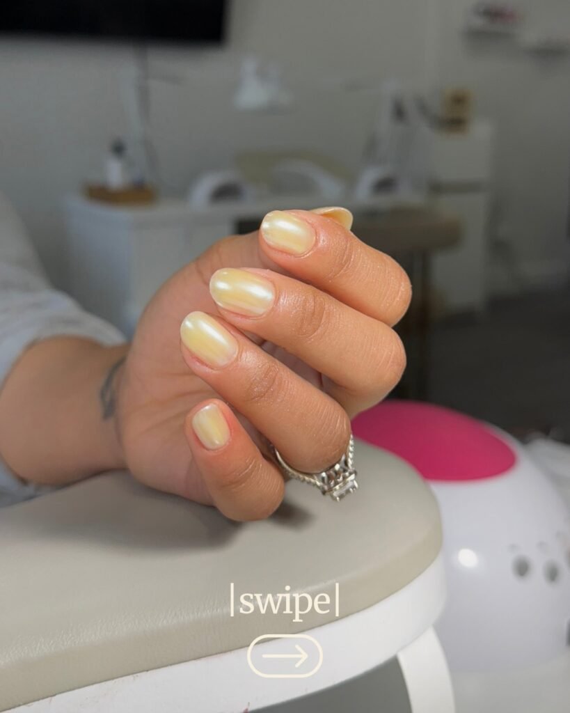 Natural nails with pearlescent shine, created using russian manicure Tampa, captured in daylight.