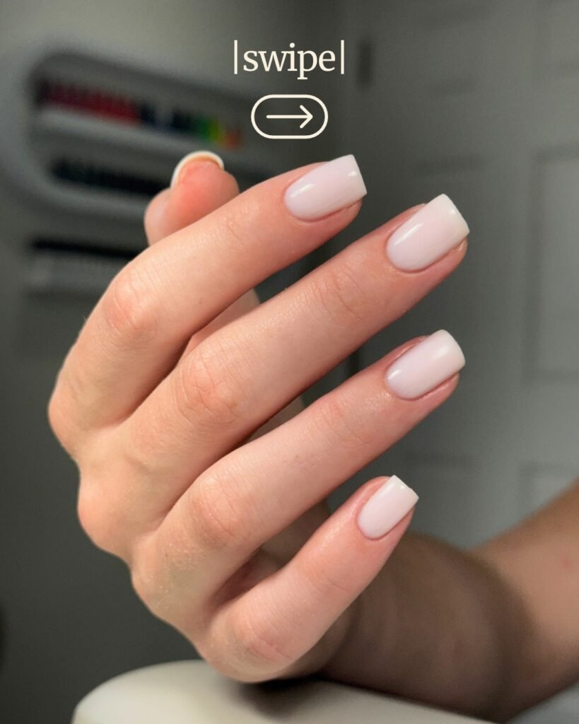 Elegant hand with soft pink nails showcasing russian manicure Tampa in natural studio light.
