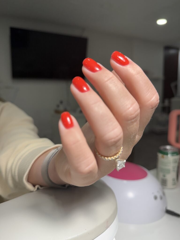 Red glossy nails after russian manicure Tampa, Florida.