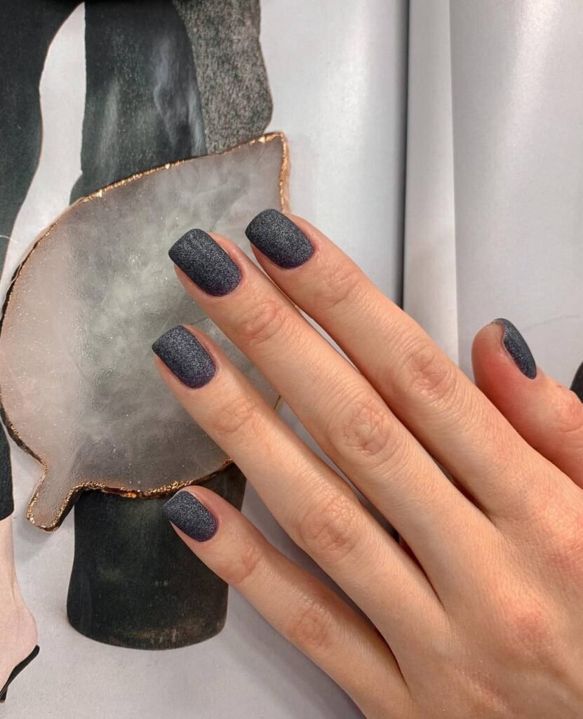 european manicure tampa with clean cuticles and matte dark finish in Tampa Florida
