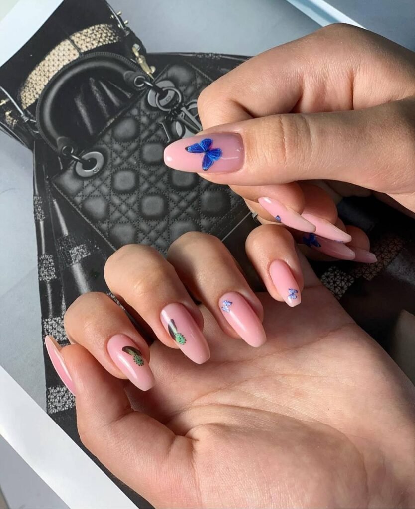 Soft pink nails with delicate design created with european manicure in Tampa