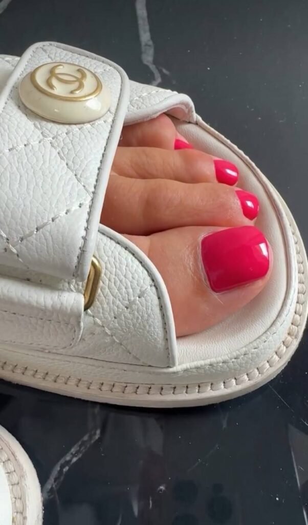 Gel pedicure Tampa with bright pink polish and clean cuticle work in Florida studio