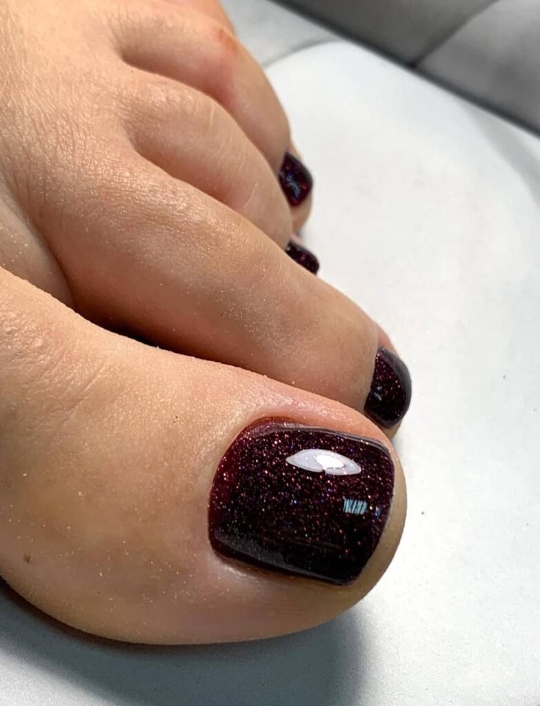 Close-up of a gel pedicure Tampa with deep glossy color and clean cuticle work in Tampa