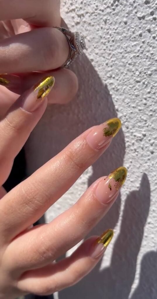 Russian manicure salon nail design with gold accents in Tampa, Florida.
