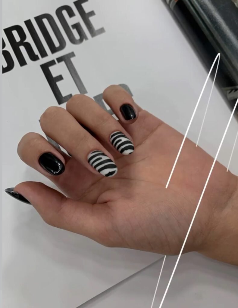 Russian manicure salon showcasing bold black and white nail design in Tampa