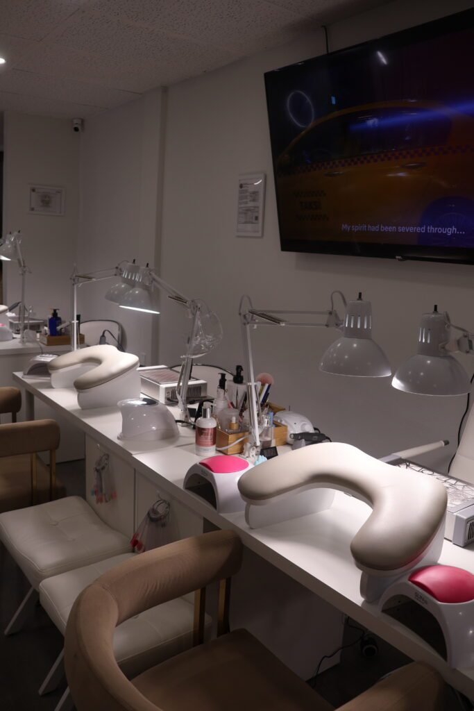 russian manicure salon workspace in Tampa with lamps and manicure stations