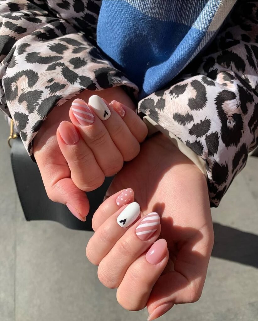 Elegant soft pink nails with precise russian manicure Tampa technique in natural daylight
