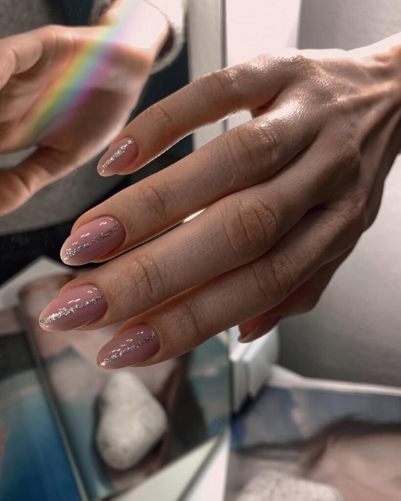 Soft almond russian manicure with silver shimmer captured in Tampa.