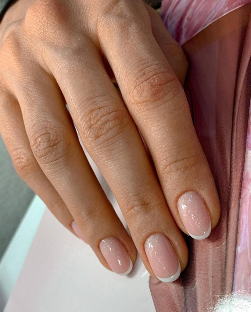 Natural soft pink nails with clean cuticles from russian manicures near me in Tampa, Florida.