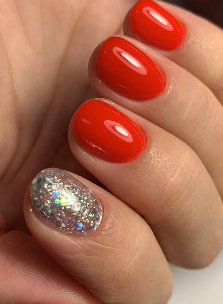 Glossy red russian nails with accent design created in Tampa, Florida