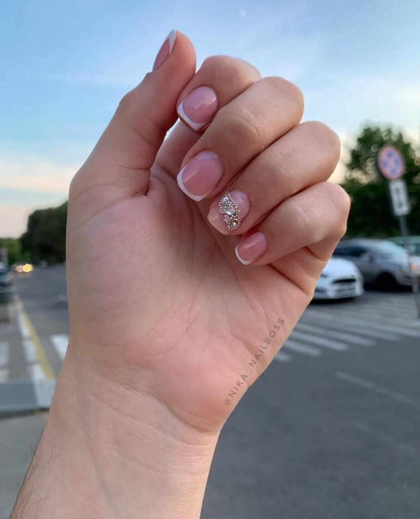 Soft pink russian nails tampa with clean cuticles and elegant detail in natural Tampa light.