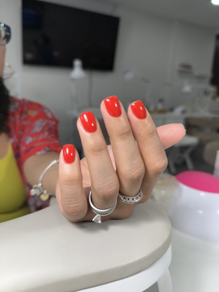 Bright red polished nails created with russian nails technique in Tampa studio.