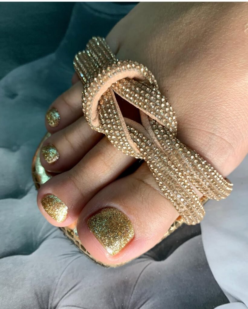 Close-up of smart pedicure with gold polish for diabetic foot care in Tampa, Florida.