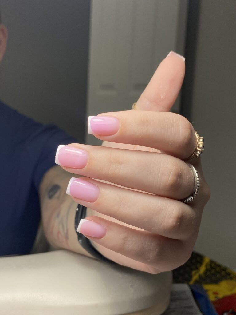 Soft pink builder gel manicure with structured French tips in Tampa, Florida