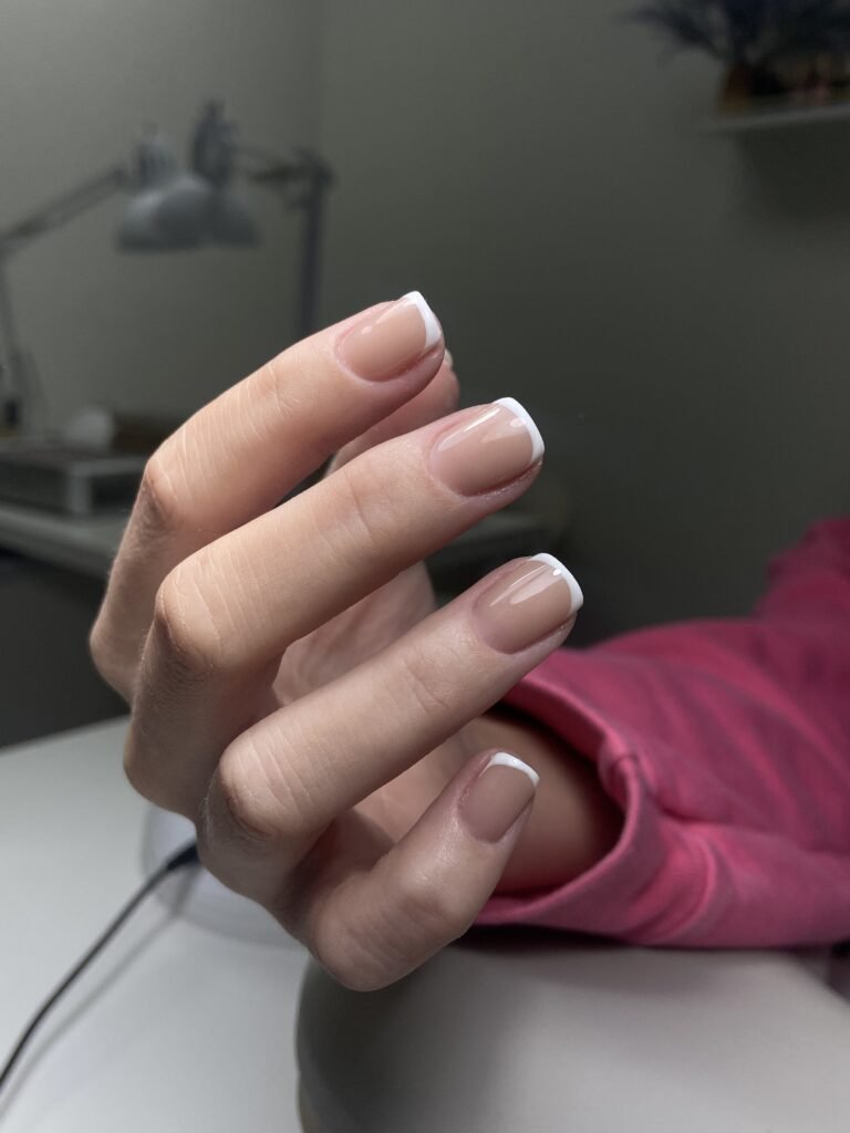 Natural nude french nails created at a russian manicure salon in Tampa, Florida with clean cuticle work.
