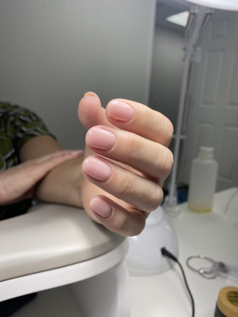 Soft pink nails created at a russian nail salon in Tampa, Florida with clean European technique
