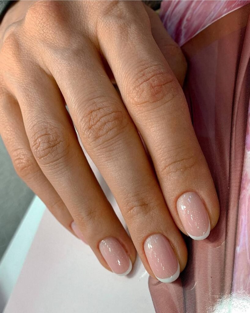 Natural pink nails after russian manicure in Tampa with clean cuticles and glossy finish