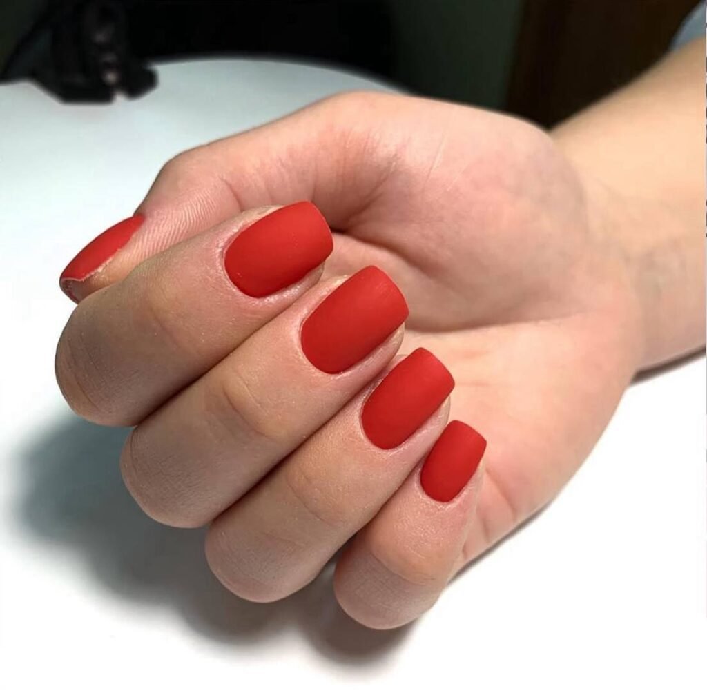 Matte red russian manicure near me in Tampa with clean cuticles and precise shape