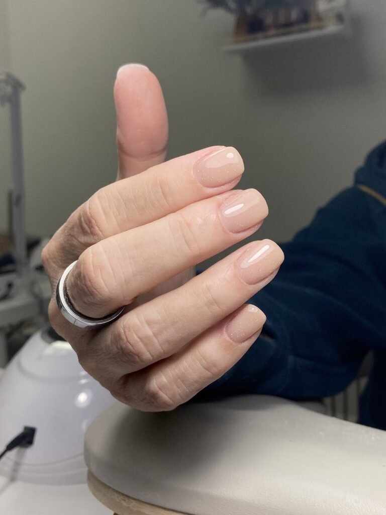 Close-up of natural nude nails with perfect structure from russian manicure in Tampa, Florida