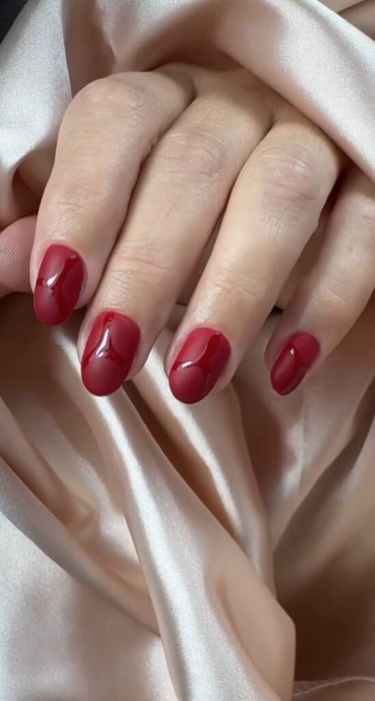 Refined red manicure created with russian manicures Tampa at Nail Boss Studio in Tampa, Florida.