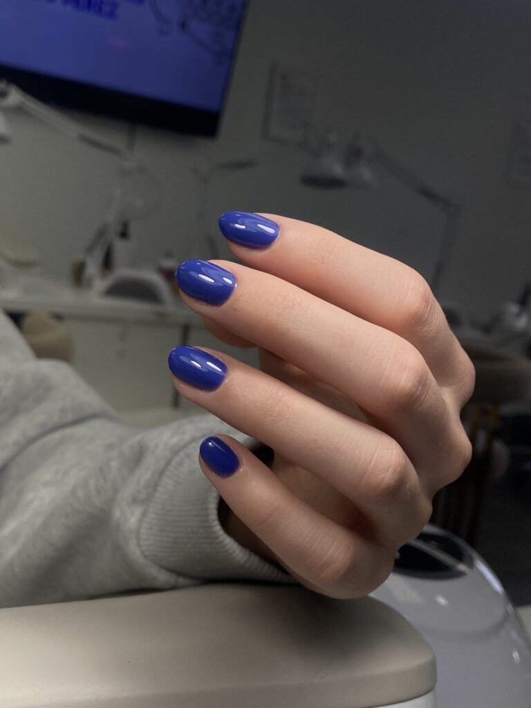 Blue structured manicure created at a russian nail salon in Tampa, Florida with clean cuticle work