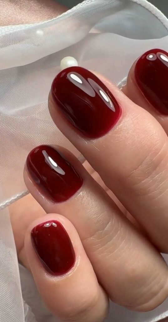 Deep red russian nails with flawless cuticle work at Nail Boss Studio Tampa, Florida