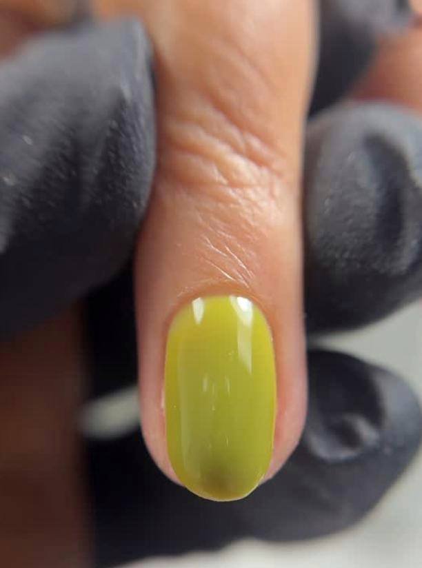 Close-up of hydrated hands with russian nails tampa style manicure in a Tampa nail studio.