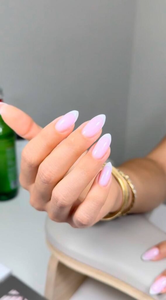 Soft pink almond nails created with a tampa russian manicure technique in Tampa, Florida.