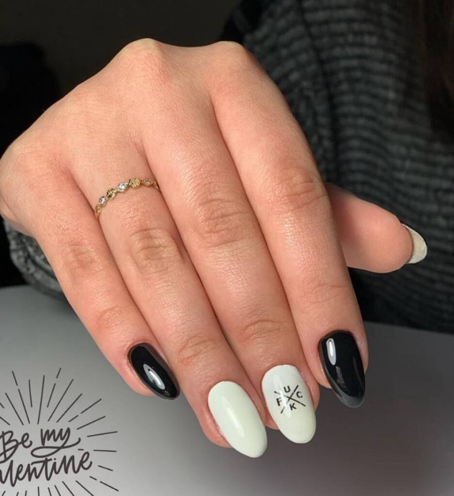 Soft almond shape builder gel manicure in Tampa, Florida at Nail Boss Studio with mint and black design.