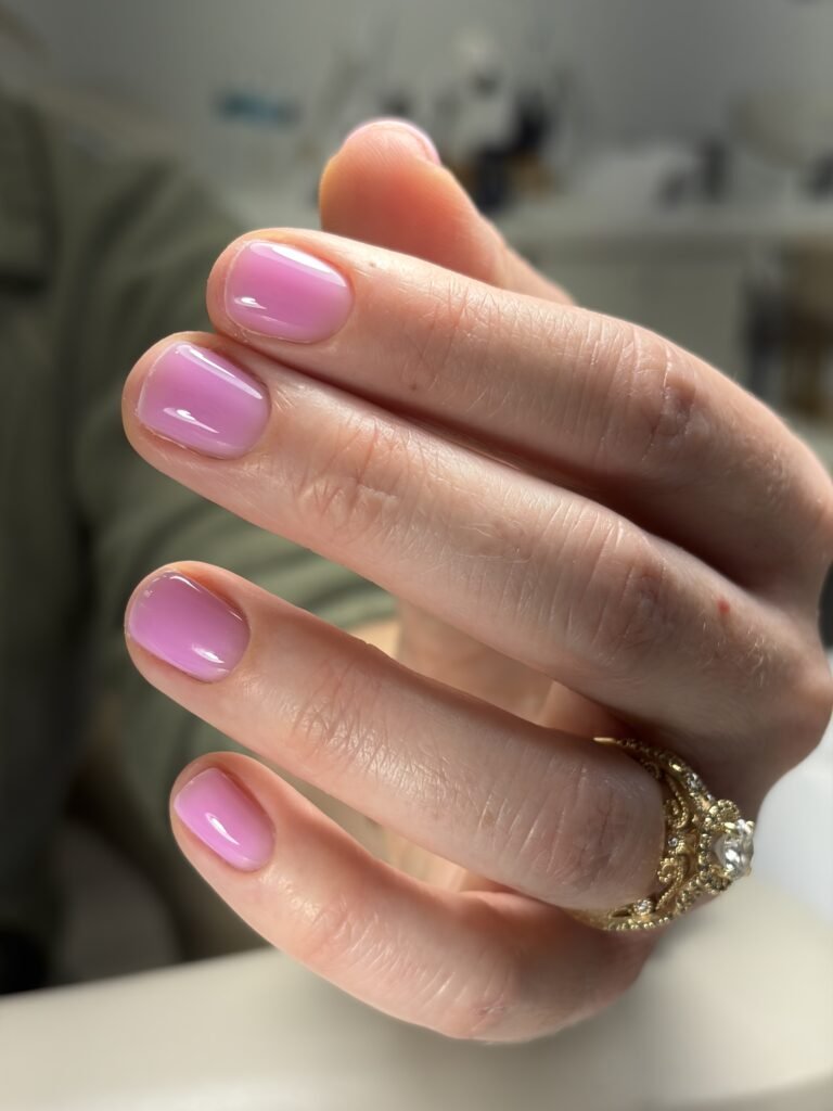 Clean builder gel manicure in Tampa with soft pink finish and natural shine.