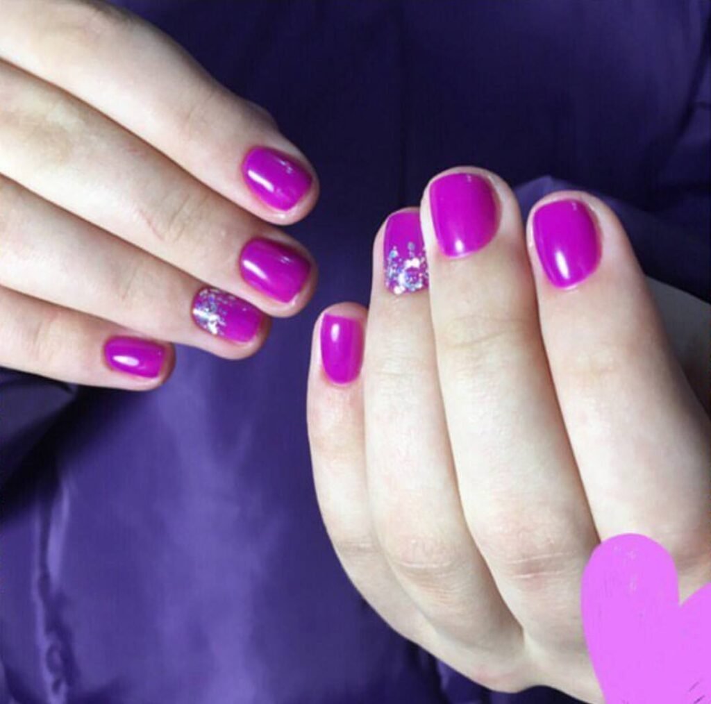 Glossy pink dry manicure in Tampa, Florida with precise cuticle work and balanced shape at Nail Boss Studio.
