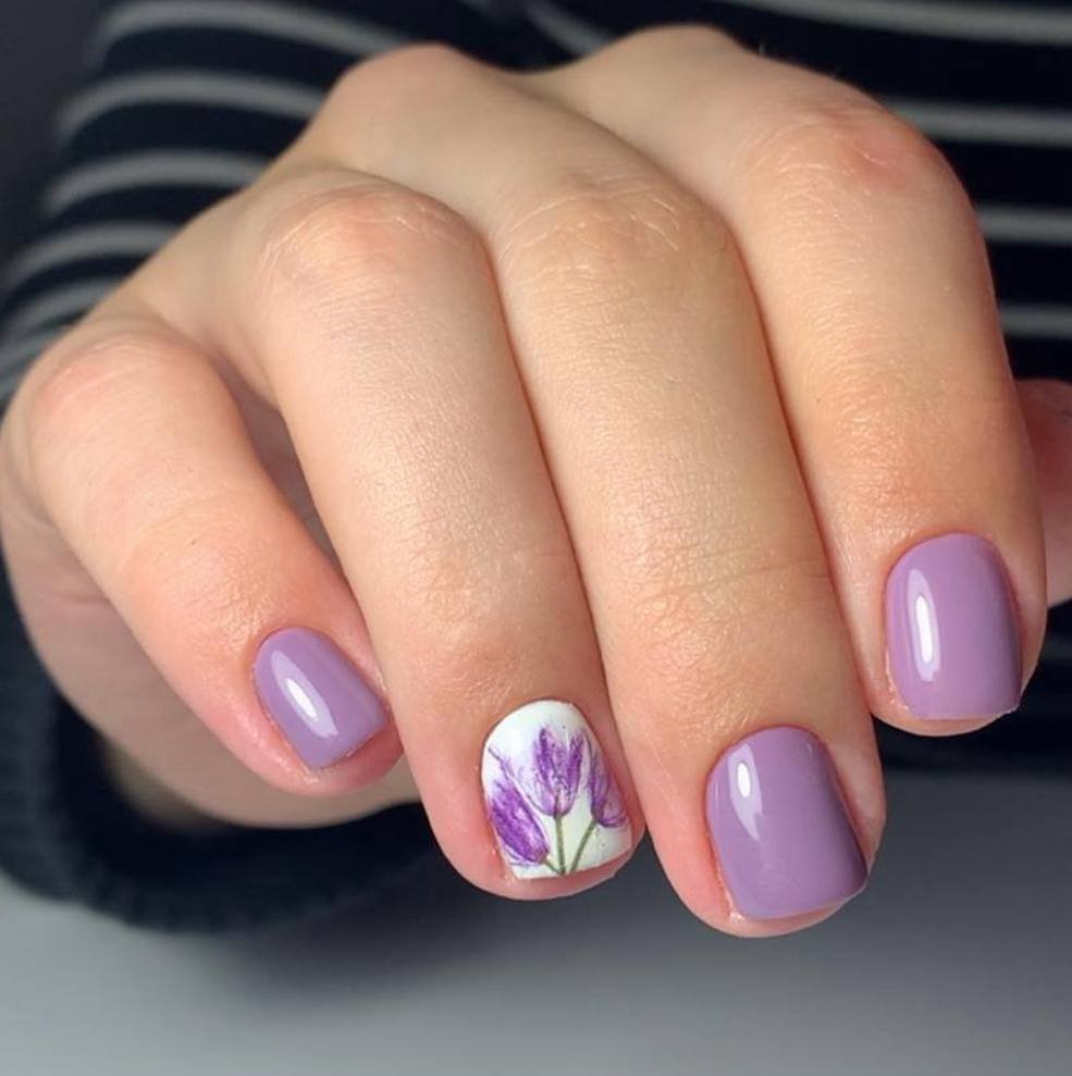 Soft lilac european manicure with floral accent nail in Tampa, Florida at Nail Boss Studio